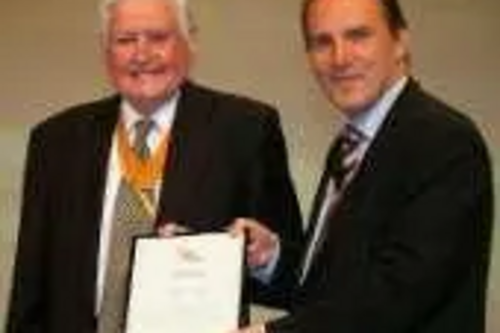 Former Lib Dem mayor Derek Hardy receives his award from Simon Hughes MP, Party President