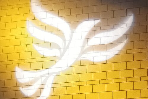 Lib Dem logo bird projected on blockwork