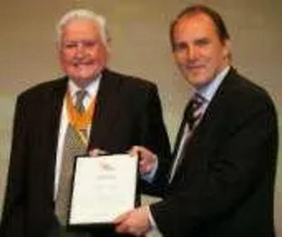 WELL DONE: Former mayor Derek Hardy receives his award from Simon Hughes MP