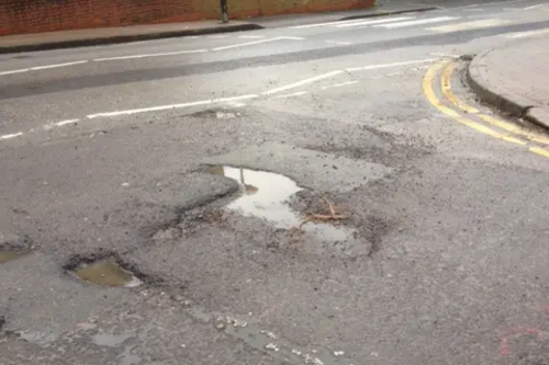 Pothole at King's Chase/Kings Road junction, Brentwood West