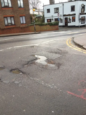 Pothole at King's Chase/Kings Road junction, Brentwood West