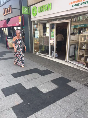 Brentwood High Street, Oxfam, non-paving slab poor eyesore repair with pedestrian