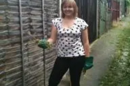 Cllr Karen Chilvers bags up one of the ten bags of green waste