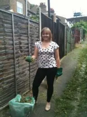 Cllr Karen Chilvers bags up one of the ten bags of green waste