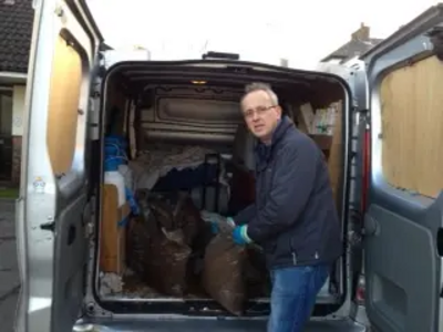 Cllr David Kendall delivering salt bags