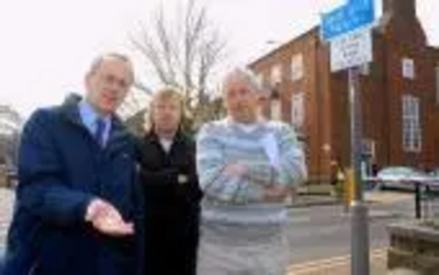 Cllr David Kendall, shop owner Nigel Clarke and Cllr Barry Aspinell.