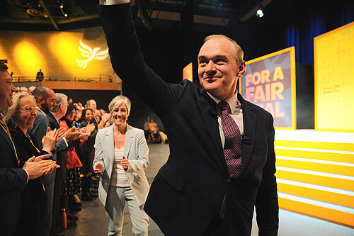 Ed Davey leaves the stage after his speech to Spring Conference
